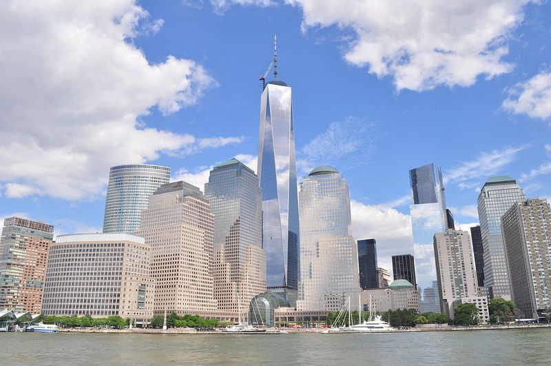 a picture of One World Trade Center and the skyline surrounding it taken from New York Harbor