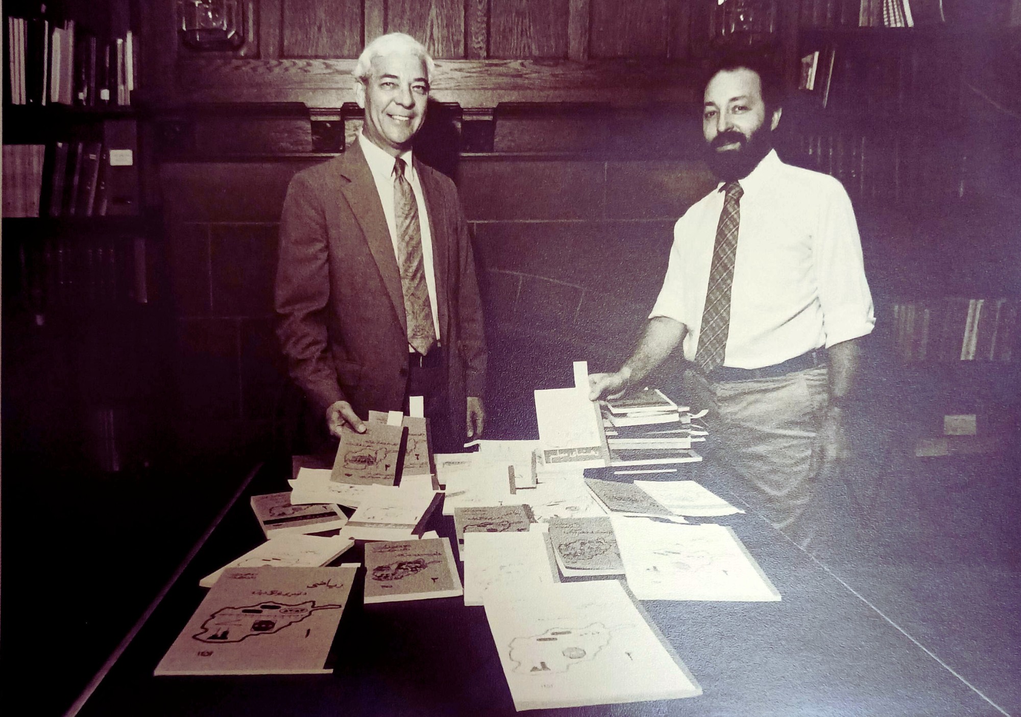 Professor Thurston A. Atkins and David Ment at the library’s Afghanistan Textbook Exhibit, 1984.