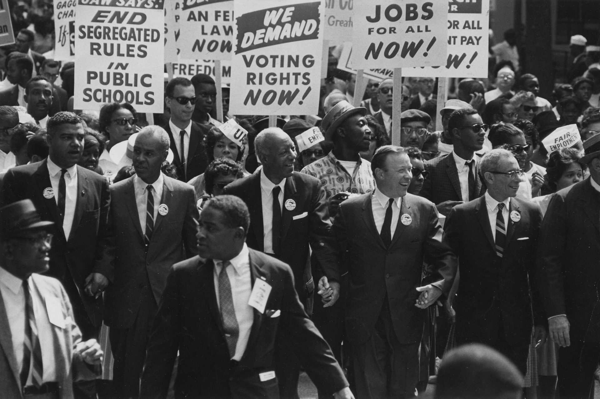 Civil Right Leaders March with Signs